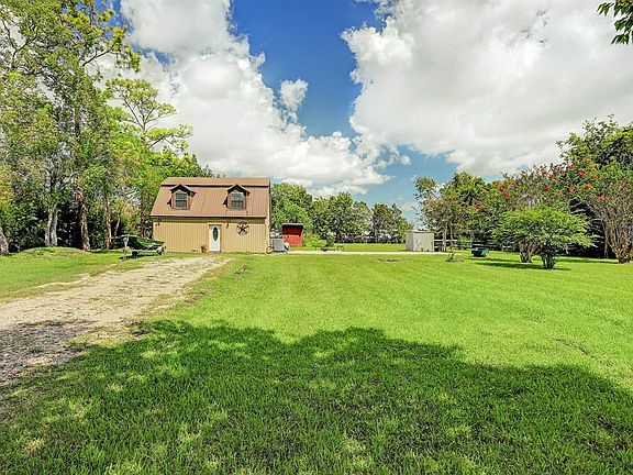 Sitting on just under ONE ACRE, this home is situated towards the left side of the land with large front and back yard areas.