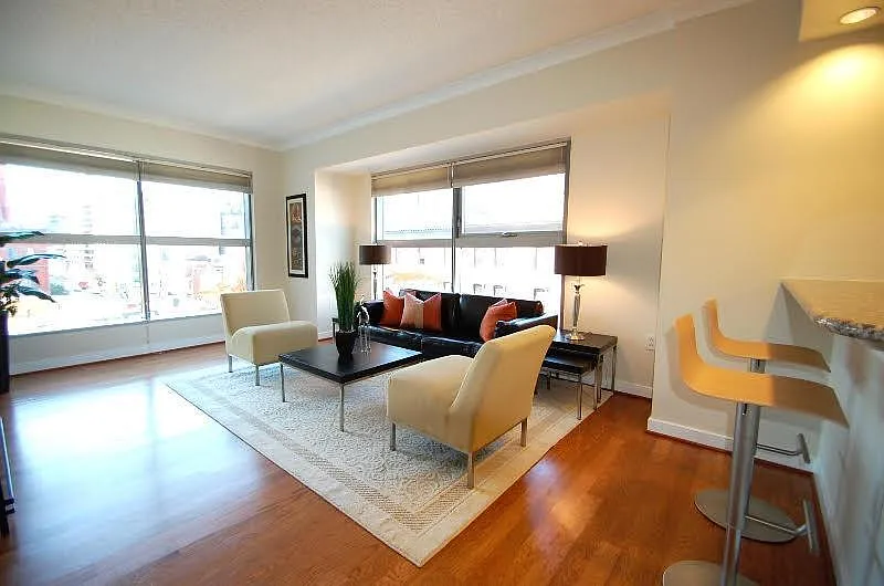 Sun-Filled Living Area with Floor-to-Ceiling Windows - 777 7th St NW #436