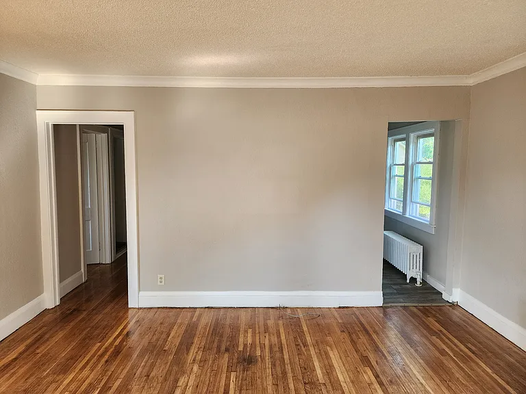 Living room facing towards Hallway and kitchen