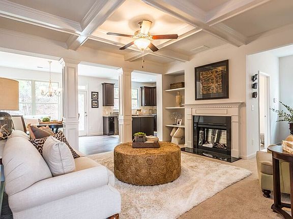 Open and flowing family room with coffered ceiling