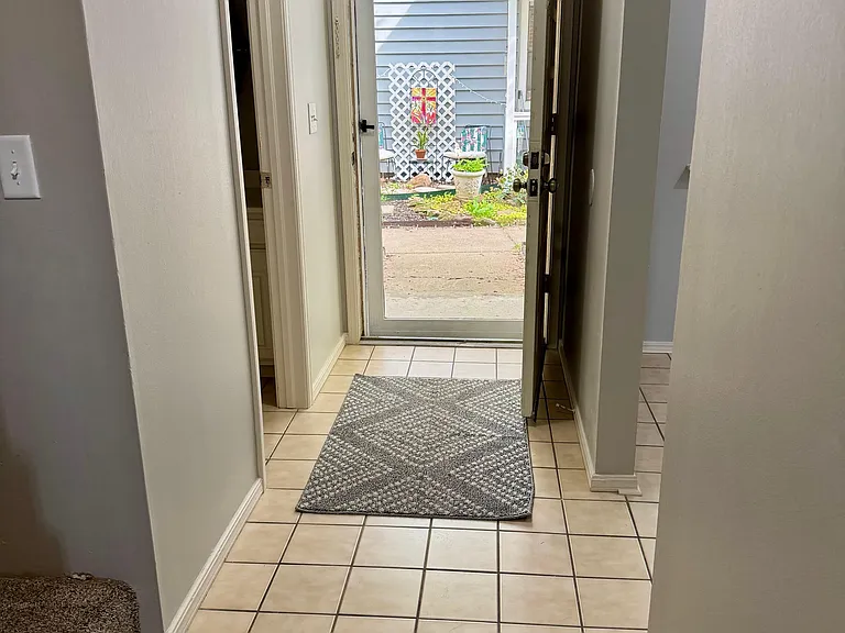 Tiled entry and vinyl hardwood-like floors