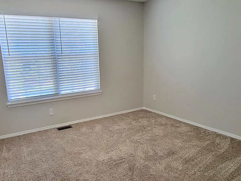 Upstairs 2nd bedroom -- windows on front side.