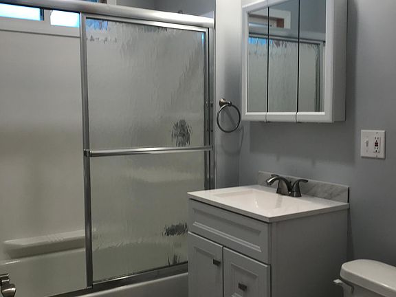 Brand new bathroom - new vanity, lighting, flooring and bath.