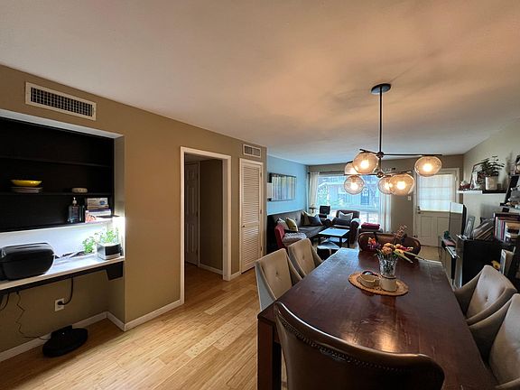 Small built-in desk on the left, adjacent to dining room
