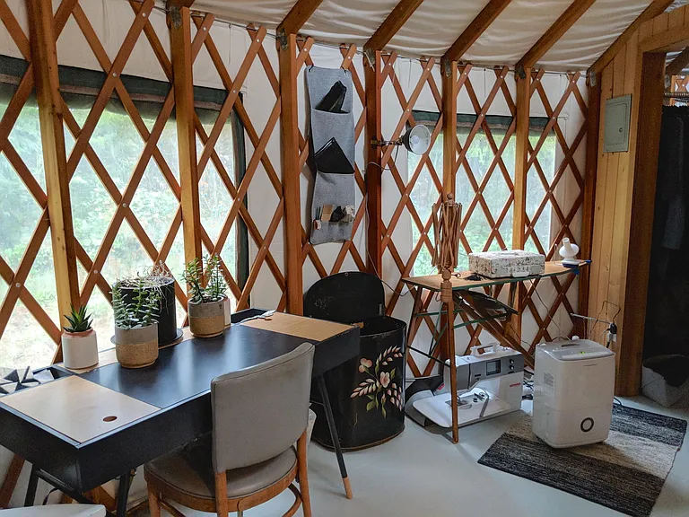 Part of the living room, with previous tenant's furnishings. The yurt comes unfurnished.