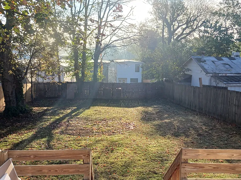 Looking from deck to rear of alley. New deck installed.