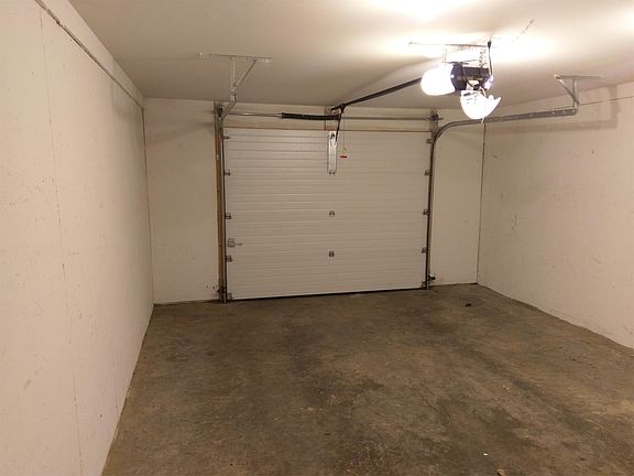 one car garage with garage opener and keypad