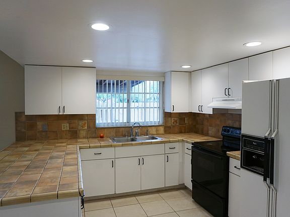 Spacious kitchen with italian tile counter tops