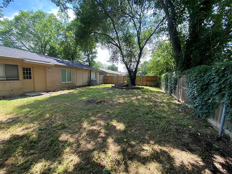 Yard with all new Wood Fence, completely fenced in.