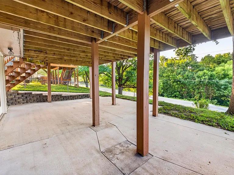 Patio with access to yard and deck