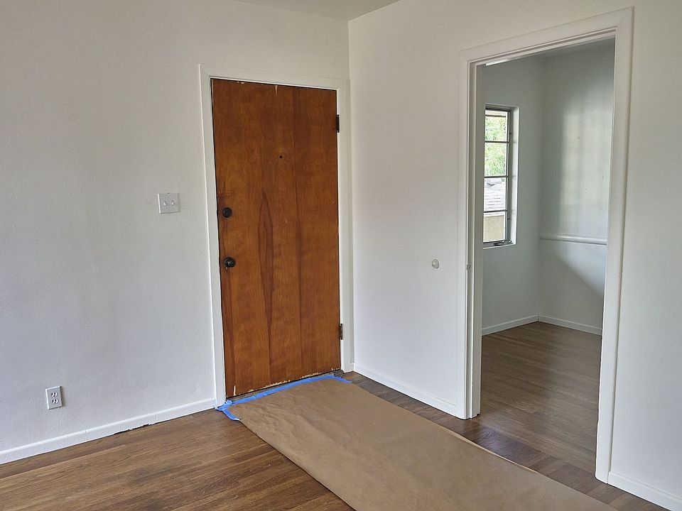 Living room and entrance to kitchen