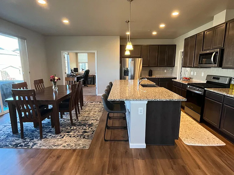 Four seat island and private office adjacent to dining area