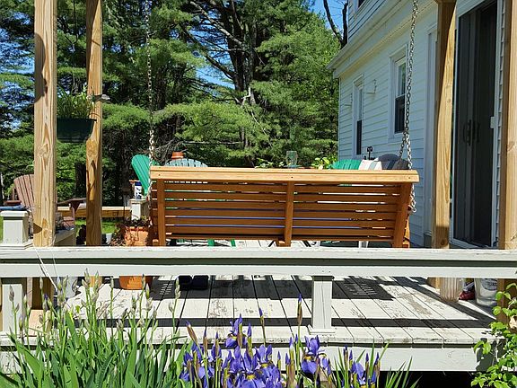The deck has a porch swing