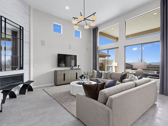 Two-story ceilings in the gathering room with bright, sunny windows.