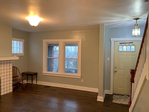 Another view of living room and front door