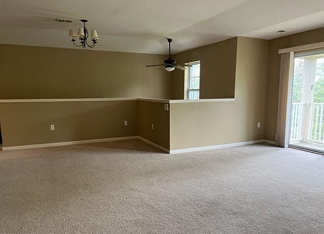 Spacious living room with lots of sunlight along with a walkout balcony
