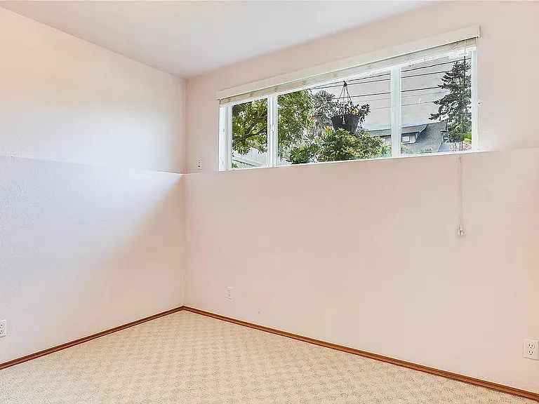 Lower level Bedroom with high ceiling
