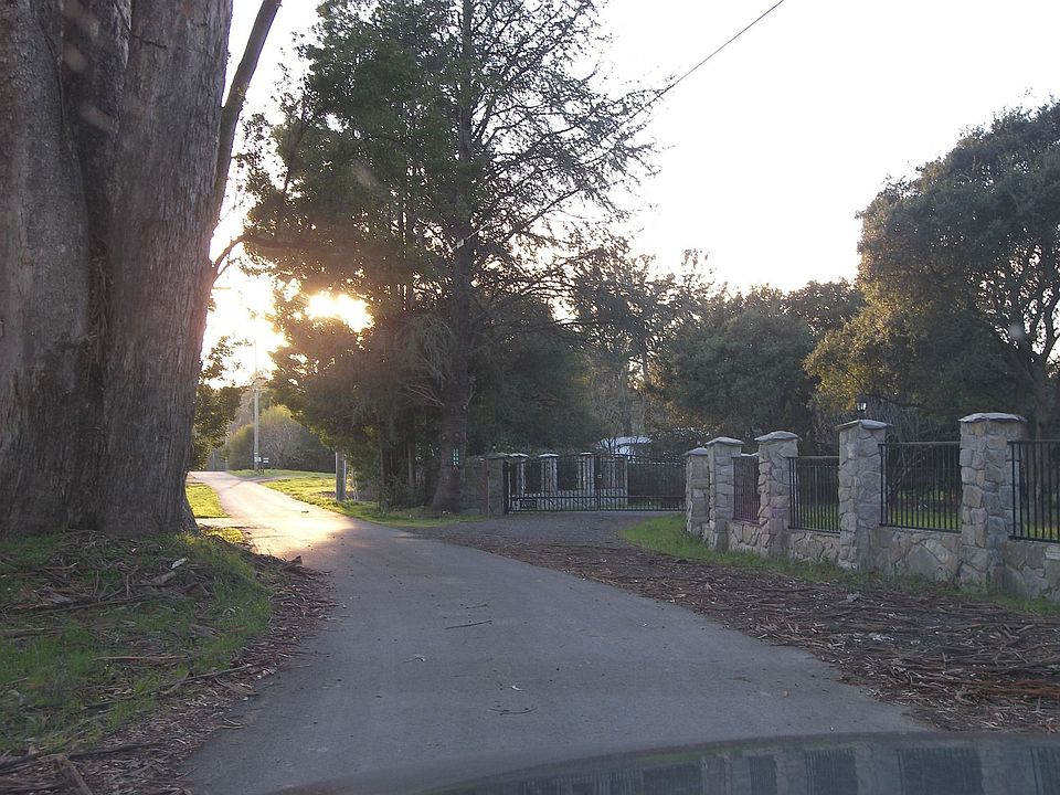 Country lane going towards homes
