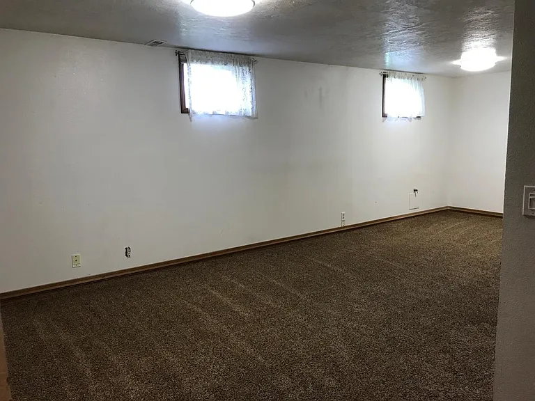 Basement family bedroom with newer carpet