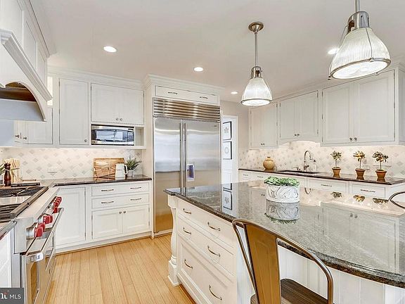 Remodeled kitchen featuring center island, wine refrigerator