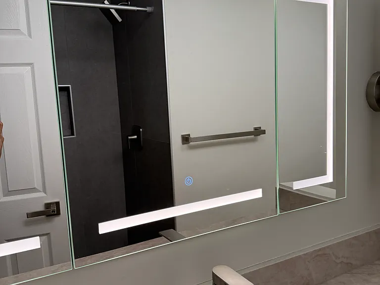 Mirrors have touch tap lights that turn into a couple different light modes. Ideal for skincare and beauty.
