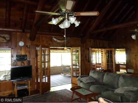 Great Room looking in seasonal porch through French doors