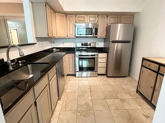 Kitchen with granite and stainless steel appliances
