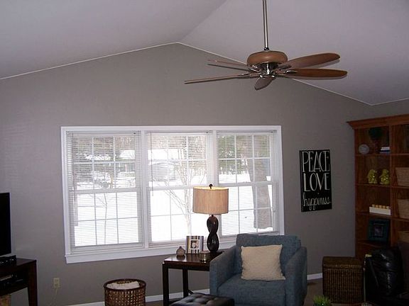 Living room is also features a cathedral ceiling.