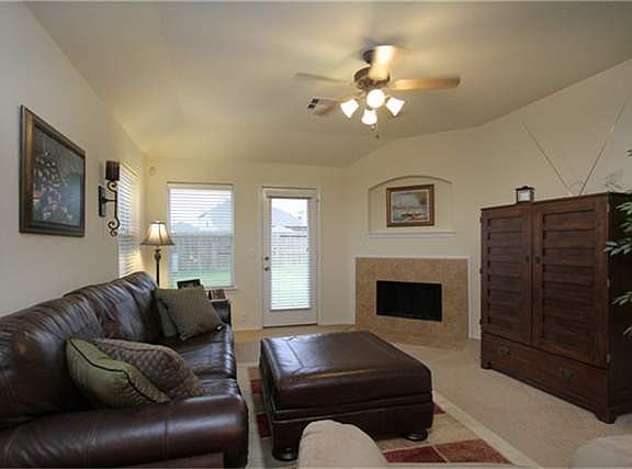  THIS HOME LIVES LARGE WITH AN OPEN FLOOR PLAN. THE MAIN AREA FEATURES A COMIBNATION LIVING & FORMAL DINING ROOM, OPEN TO THE ISLAND KITCHEN WITH BREAKFAST BAR.  THE FAMILY ROOM HAS A WOODBURNING FIREPLACE WITH ART NICHE ABOVE.