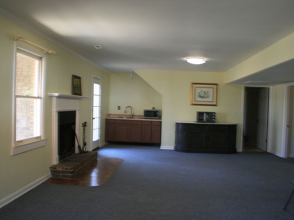 Large living area with wet bar, microwave and air fryer.