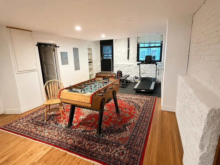 Bonus room with foosball and fitness area.