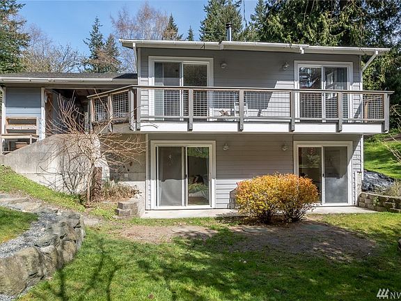 All the sliding glass doors let in the light. The back yard was designed by local landscape architect Fran Abel.