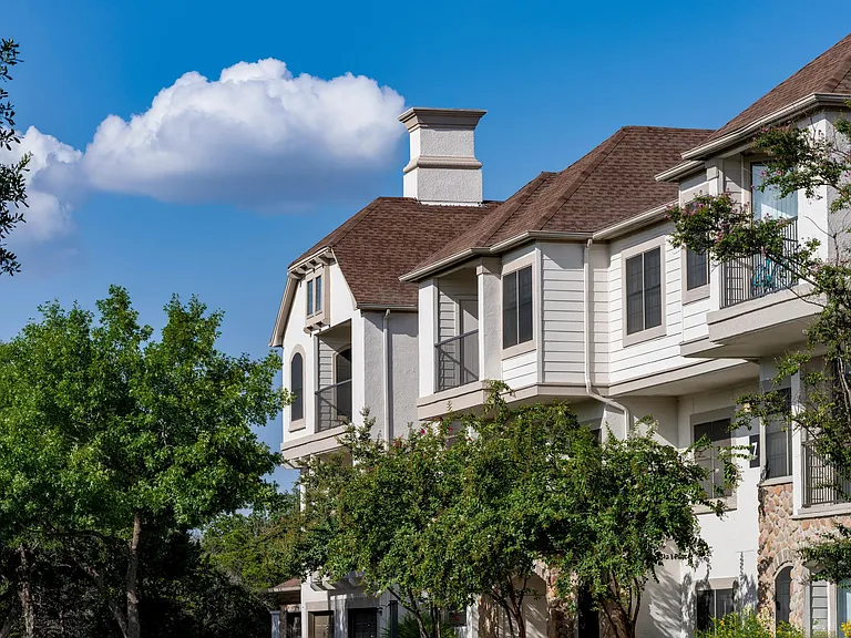 Classic architecture and mature trees add charm to everyday living at Alister Sunset Valley.
