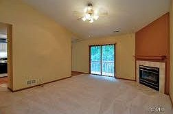 Living room with vaulted ceiling, corner fireplace and surround sound wiring