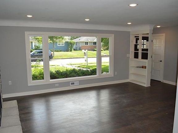 Large open living room with lots of natural light.