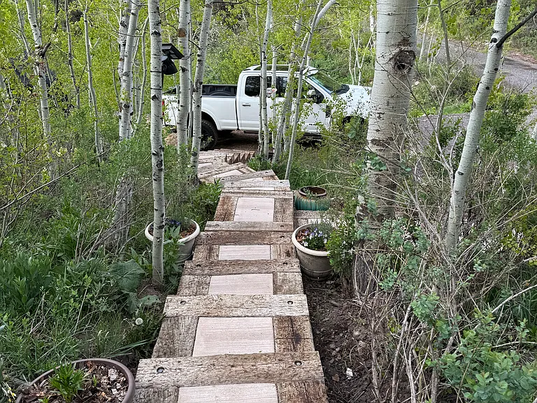 Stairs down to one of the parking pads