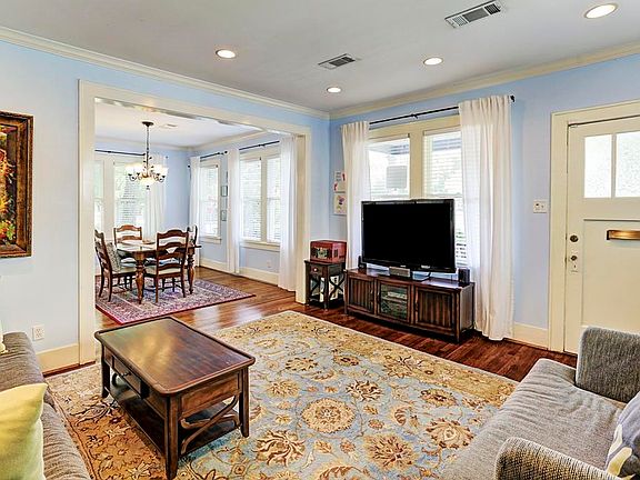 Craftsman entry door into spacious open living area.