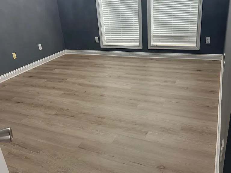 Bedroom #1 with new LVP flooring, new blinds and ceiling fan with remote control. 
High ceiling with two large windows for natural light.