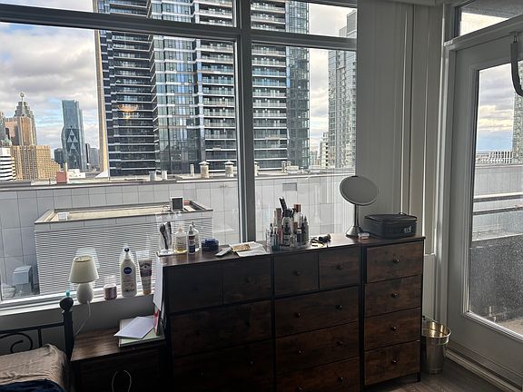 current tenant's room with the balcony door