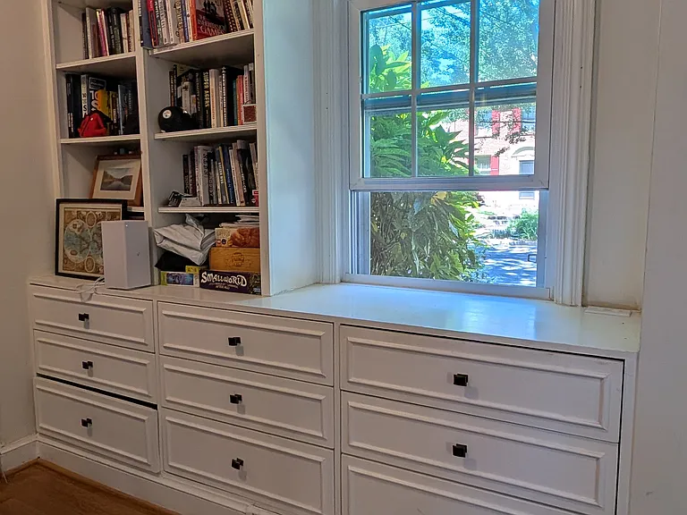 Built- in bookcases and drawers in dining room