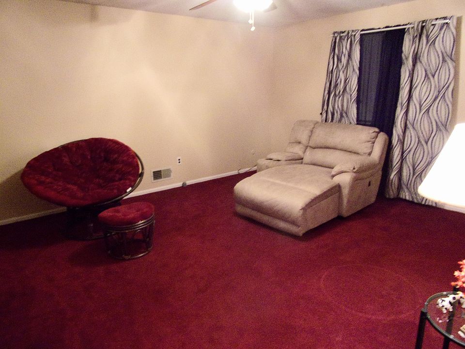 Living room with wall-to-wall carpeting