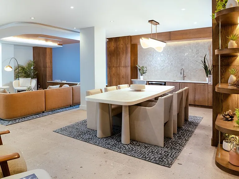 Lounge with kitchenette and seating areas