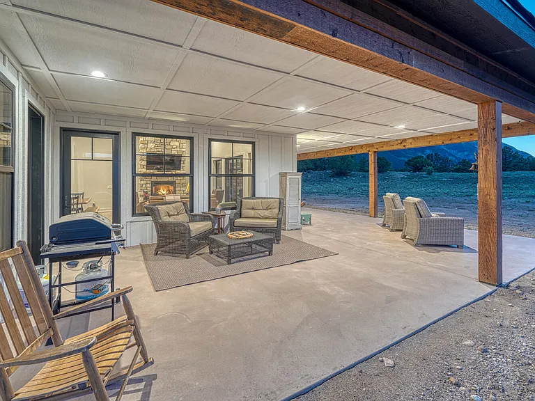 The Chalk Cliff Suite side of the patio hosts the BBQ grill. Play a game of tic tac toe or just listen to the breeze. Every spot has a spectacular view.