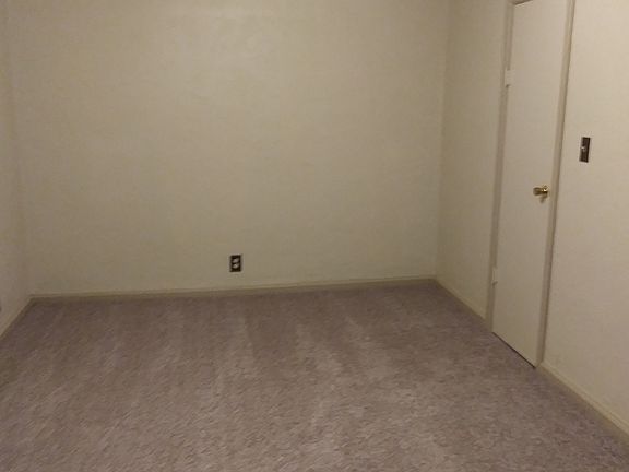 Bedroom w/ Customized Closet System.