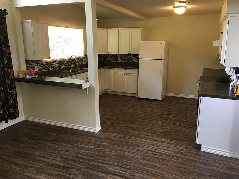 Large kitchen- lots of cabinets and counter space and large