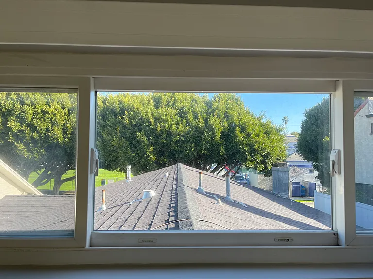 Bedroom window out towards 5th Street and school across the street