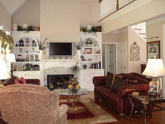 An open floor plan with hardwood floors throughout the main level.