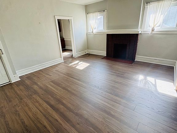 Living space, fresh flooring, lots of natural light.