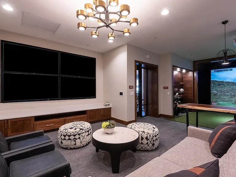 The sports lounge is equipped with a television and comfortable seating.