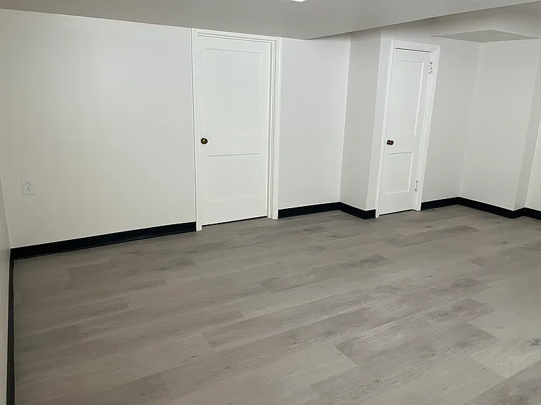 Finished basement. Left door to utility room and right door to bathroom.